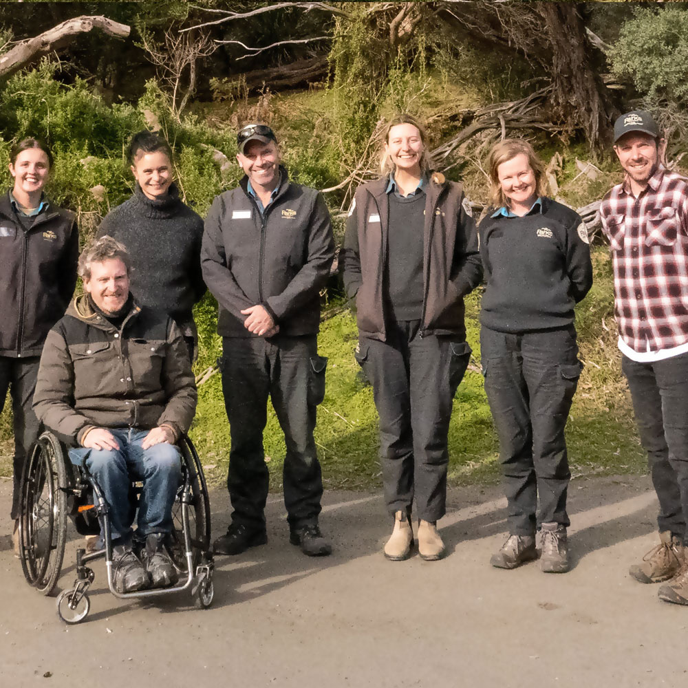 Ryan at a park with outdoor gear on and off-road wheelchair tyres