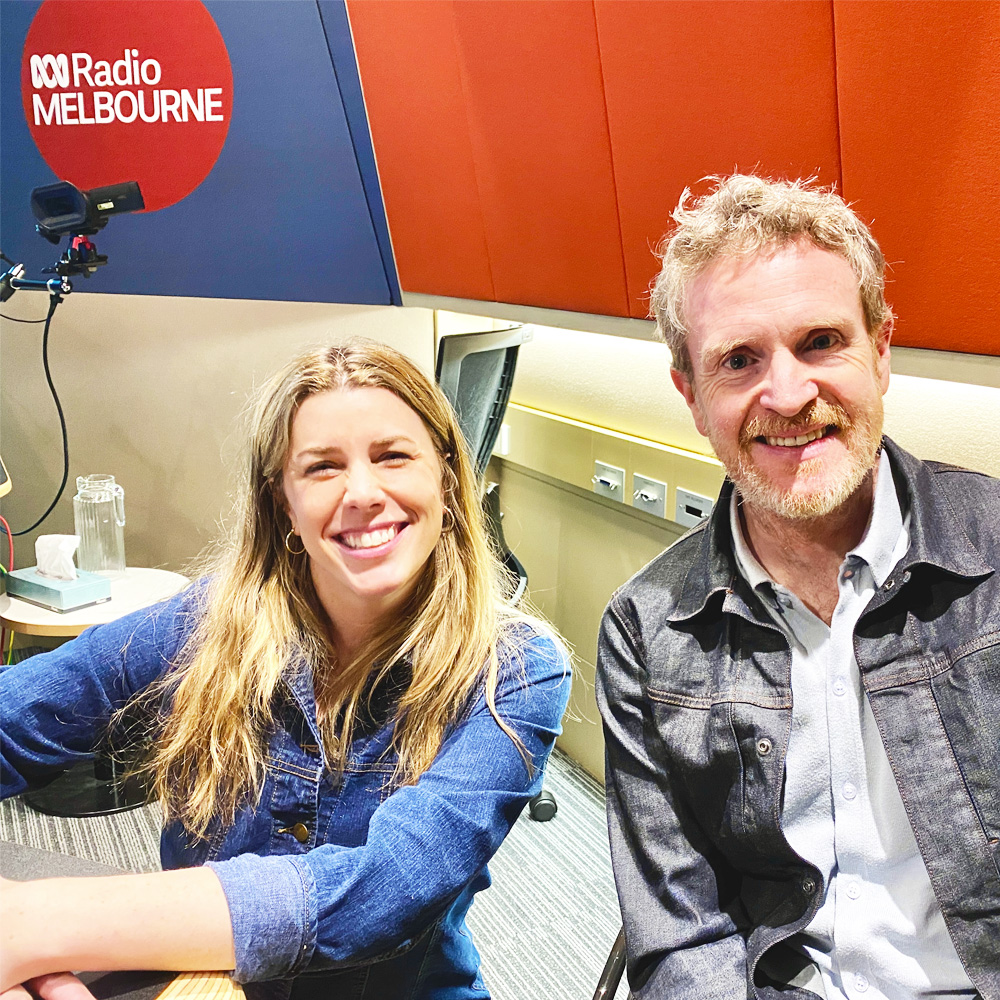 At ABC Radio studios Melbourne Ryan and presenter Alice Zaslavsky smile